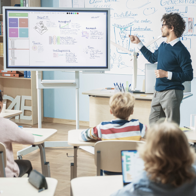 Teacher at chalkboard