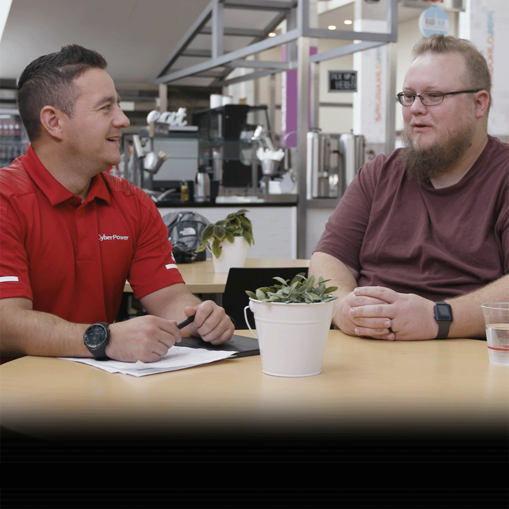 Three people in board room discussion