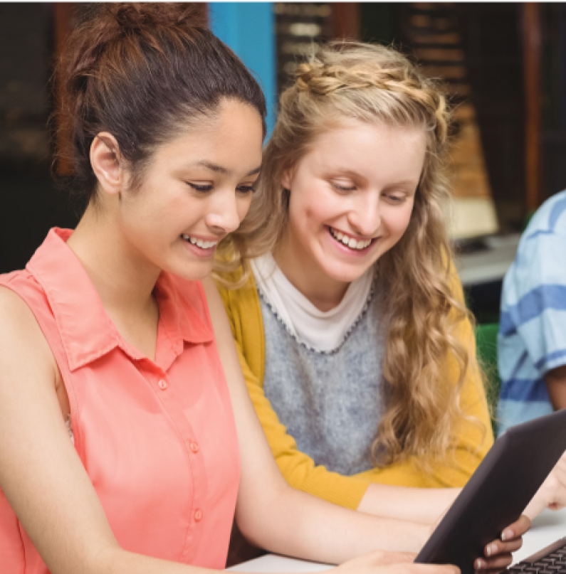 Student raising hand in classroom